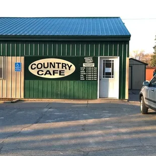 two cars parked in front of a building