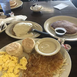 Country fried steak with eggs and one pancake