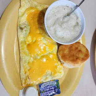 Veggie omelette with biscuit and grits.