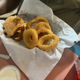 Cheese burger and onion rings.