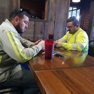 Serious people eating at the cafe today.
