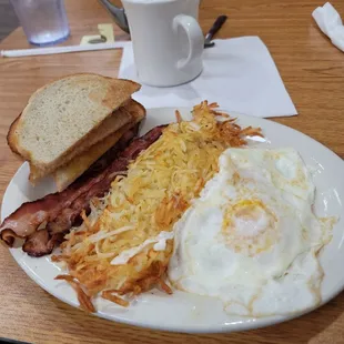two eggs over medium, hash browns not burnt, bacon sourdough toast and coffee