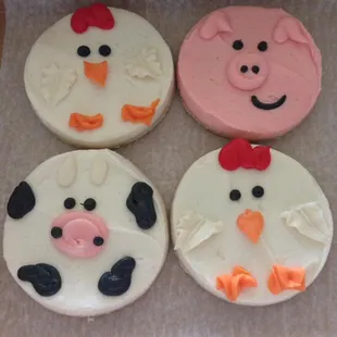 three decorated farm animals