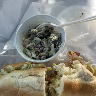 a sandwich with a side of coleslaw
