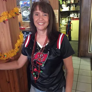 a woman standing in front of a bar