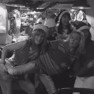 a black and white photo of a group of friends