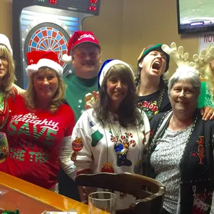 a group of people dressed up for christmas