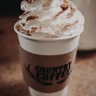 a cup of coffee with whipped cream