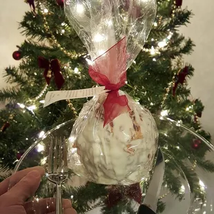 Chocolate covered apple with nuts