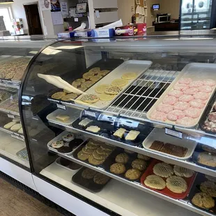 a variety of cookies in a display case