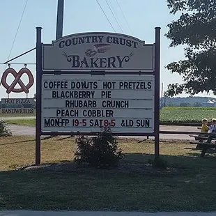 Quaint little sign pokes up over the horizon.