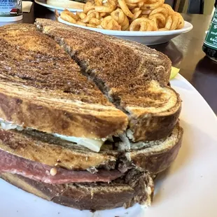 Ruben curly fries and chicken fried steak sandwich