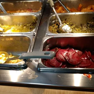 a variety of food items in a buffet