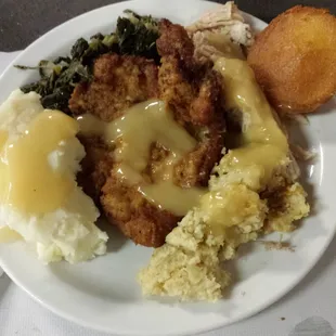 Pork chop...turkey. ..stuffin....mashed taters...corn bread...mmmmm
