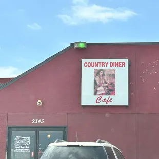 a car parked in front of the restaurant