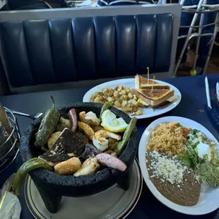 Molcajete - $17   (Breakfast sandwich in background)