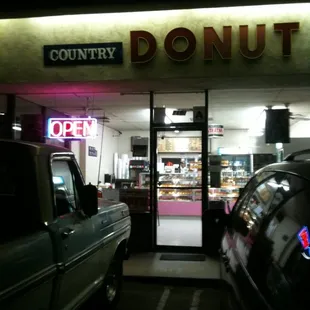 a car parked in front of a donut shop