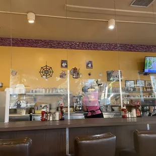 a woman behind the counter