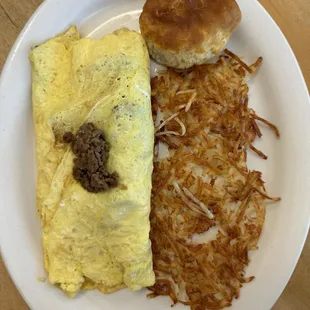Beef bulgogi Korean omelette with hash browns and biscuit.