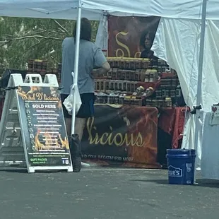 a man standing under a tent