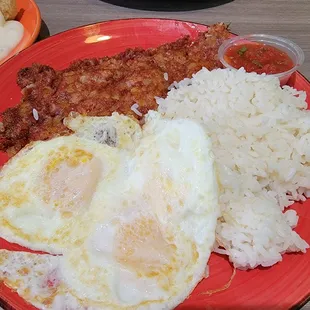 Perfectly crisp cornbeef hash with eggs with of course steamed white rice.