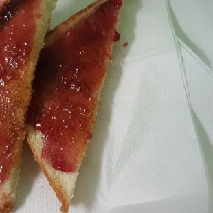 two pieces of bacon on a napkin