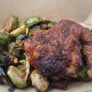 Quarter chicken with side of Brussel sprouts