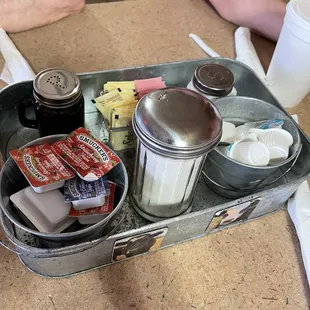 Cute tray of condiments in each table.