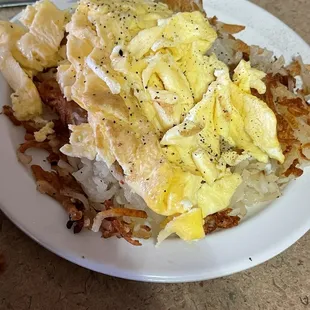 Eggs and hashbrowns. Sorry not the best pic I already added pepper to them