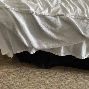 The bed sheet.