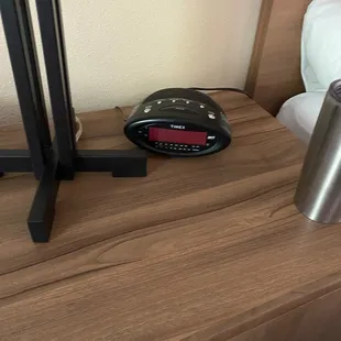 Unplugged clock because there were no available plugs to plug the clock in.