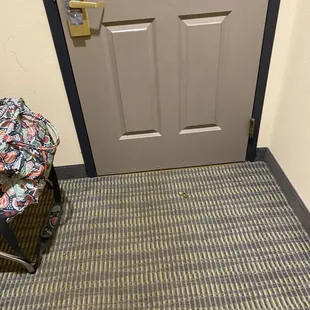 Deadbolt lock knob on the floor