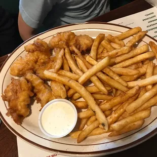 Chicken strip dinner $10.99, includes choice of 3 sides. We chose soup, salad and fries.