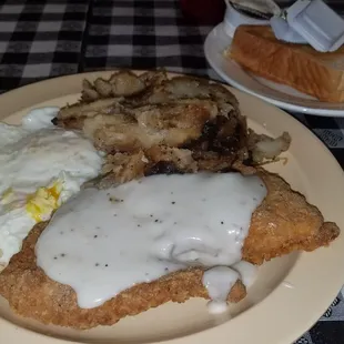 Chicken fried chicken, eggs over easy, home fries, and toast