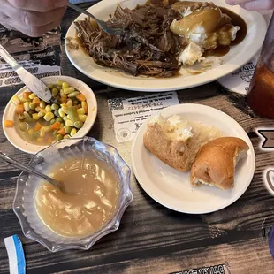 Turkey gravy, roll and butter and mixed vegetables