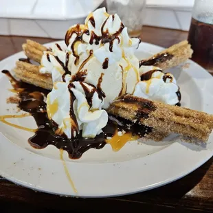 a banana split with ice cream and caramel sauce