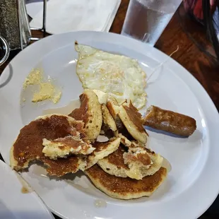 a plate of pancakes and eggs