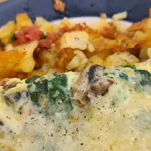 Popeye Omelet- spinach, onions, cheese, bacon and mushroom with Country potatoes.  I had it with fresh salsa... so good!