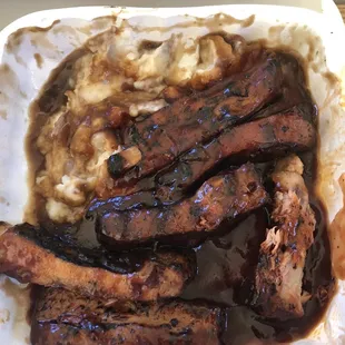Pork ribs and mashed potatoes after I sampled.
