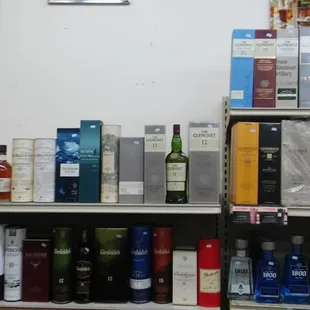 a shelf of liquor bottles