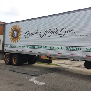 a truck parked in front of a building