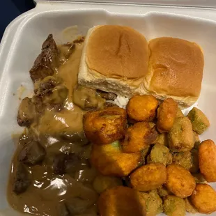 Beef tips over rice and fried squash and okra