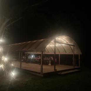 a gazebo lit up at night
