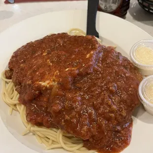 Veal Parmesan, two large pieces underneath...