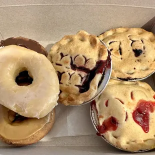 Donuts and mini pies (cherry, blackberry &amp; blueberry)