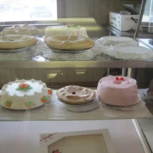 a variety of cakes on display