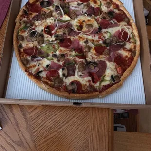 Classix country Pizza special. Pepperoni, ham, salami, sausage, mushrooms, onion and green pepper.
