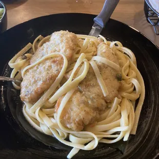 a plate of pasta with chicken