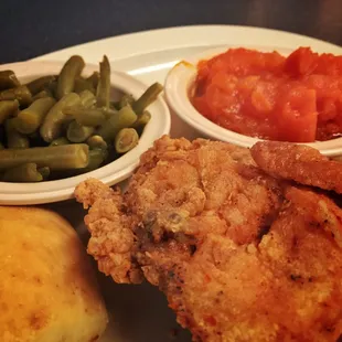 Fried chicken breast with green beans and yams.