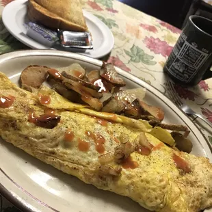 Denver omelette with toast and a side of American fries.